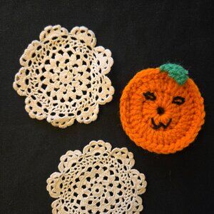 Little Handcrafted Crochet Doilies and a Crocheted Pumpkin.
